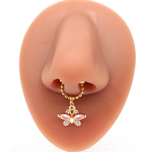 Golden beaded nose ring chain with pink butterfly pendant on a silicone model