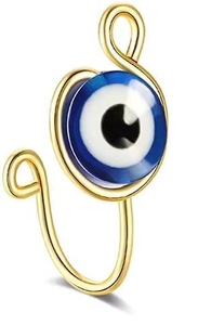 Macro detail of gold U-shaped non-pierced nose ring with blue evil eye bead detail