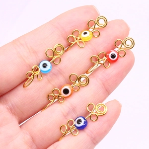 Detailed close-up of non-piercing Evil Eye nose rings in five vibrant colors with gold wire