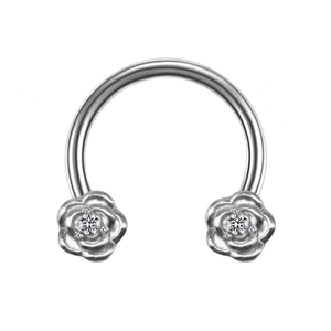 Macro shot of horseshoe nose ring with silver rose ends and clear zircon stones