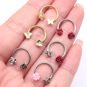 Set of 6 stainless steel nose rings featuring butterfly and flower designs in gold and silver