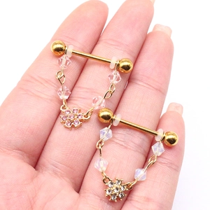 Golden stainless steel nipple rings with pink flower charms and beaded dangles