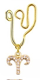 Detail of gold Aries nose cuff with shimmering cubic zirconia constellation pendant