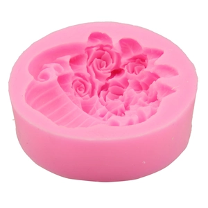 Close-up of pink silicone mold featuring intricate rose flower basket patterns for DIY baking