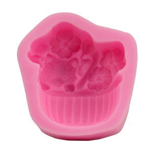 Pink silicone mold featuring a detailed flower basket and kitten design for DIY cake baking