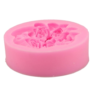 Macro detail of a pink silicone mold showing intricate rose flower cluster textures