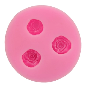 Pink silicone cake mold with three rose flower shapes for DIY baking and fondant decor