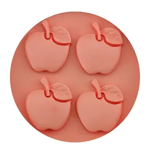 Pink silicone mold with 4 apple-shaped cavities for DIY baking and handmade soap crafts