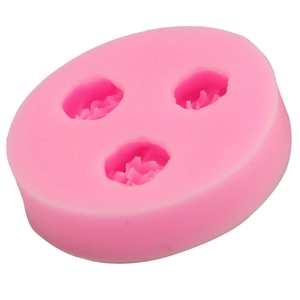 Detailed macro view of pink 3-hole rose flower silicone mold for DIY baking and crafts