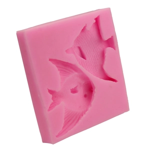 Macro detail of pink silicone fish mold with intricate textures for baking and DIY crafts