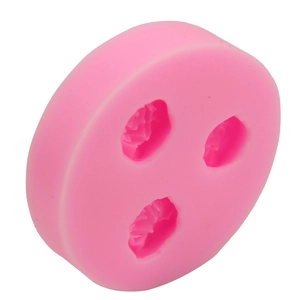 Detailed view of pink silicone mold featuring three rose flower cavities for DIY baking