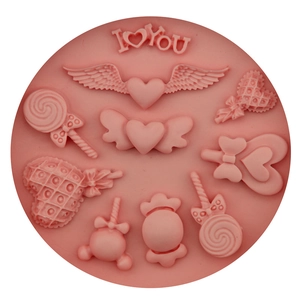 Pink silicone mold featuring heart wings and lollipops for DIY fondant and baking