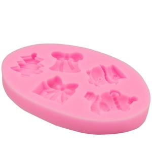 Pink silicone mold for Christmas theme DIY baking with snowman and candy cane shapes