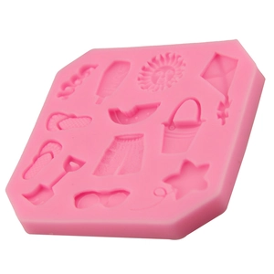 Rosa Silikonform mit Sommer-Strandmotiven wie Sonne, Sonnenbrille und Drachen