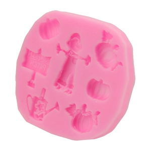 Pink silicone mold with pumpkin and scarecrow shapes for Halloween baking and DIY crafts