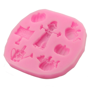 Detail of pink silicone mold with Halloween pumpkin patch and scarecrow shapes