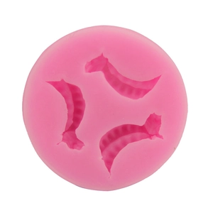 Pink round silicone mold with three pea pod shaped cavities for fondant and DIY baking