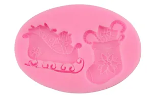 Pink silicone mold for Christmas sled and stocking shaped cake fondant and baking
