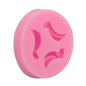 Detailed macro view of pink silicone pea pod fondant mold with three curved cavities