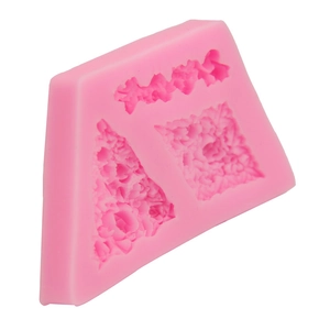Pink silicone mold detail showing three distinct floral patterns for fondant and chocolate