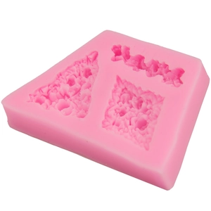 Macro detail of pink silicone mold with intricate rose flower and floral lace textures