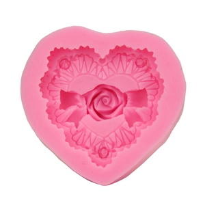 Pink heart-shaped silicone mold with rose flower embossing for DIY baking and chocolate
