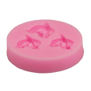 Macro detail of leaf-shaped silicone cake mold showing intricate vein textures in pink
