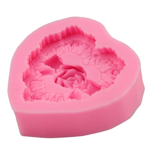 Macro detail of pink heart silicone mold featuring intricate rose flower embossed textures
