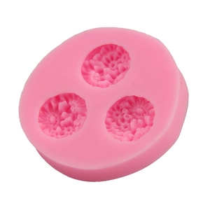 Macro shot of three-cavity daisy flower silicone mold for baking and DIY crafts