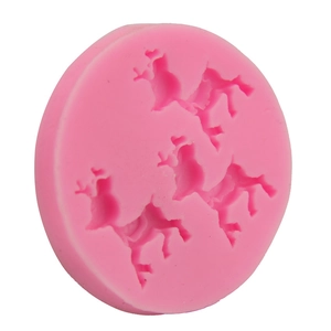 Detail view of pink silicone mold with four 3D reindeer shapes for DIY fondant or chocolate