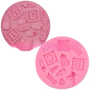 Detailed macro view of pink silicone baby themed fondant mold with bottle and bear shapes