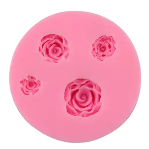 Pink silicone mold with four different 3D rose flower shapes for DIY baking and crafts