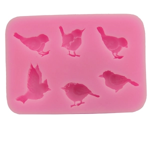 Pink silicone mold featuring six different bird shapes for DIY chocolate and cake baking