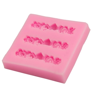 Detailed view of pink silicone rectangular mold with three rows of rose flower patterns
