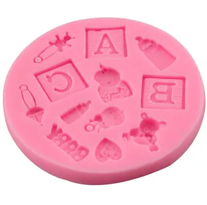 Pink baby shower silicone fondant mold featuring bottles, clothes, and teddy bear patterns