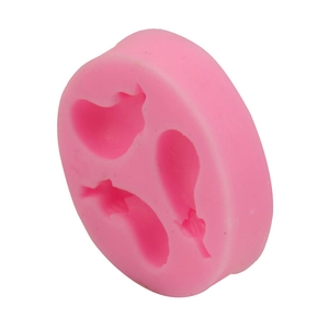 Detailed view of pink silicone mold with three eggplant-shaped cavities for DIY baking