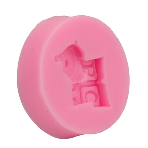 Detailed view of pink round silicone mold with cartoon character and gear cavities