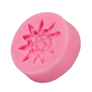 Detail of flower shaped pink silicone mold for fondant DIY baking and soap making