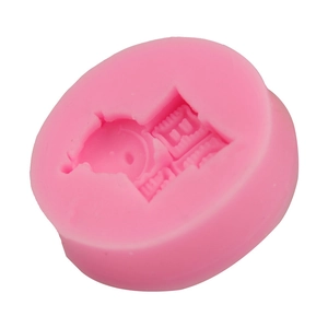 Detailed pink silicone mold featuring intricate castle relief for DIY cake decorating