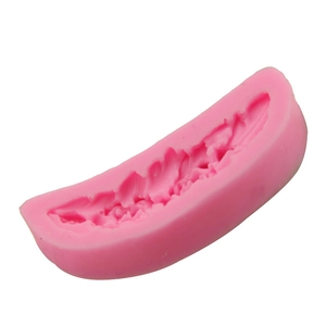 Macro shot of the detailed feather texture inside this pink silicone fondant mold