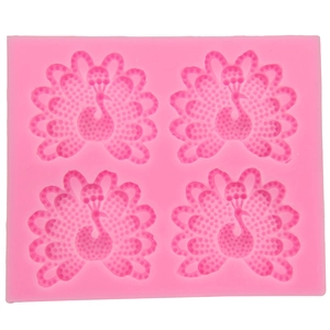 Pink silicone cake mold featuring four detailed peacock designs for DIY baking and crafts