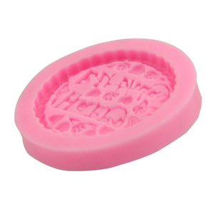 Macro detail of pink silicone mold with floral and scroll pattern for DIY baking