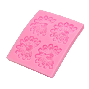 Detail of pink silicone peacock feather mold with four cavities for DIY baking and crafts