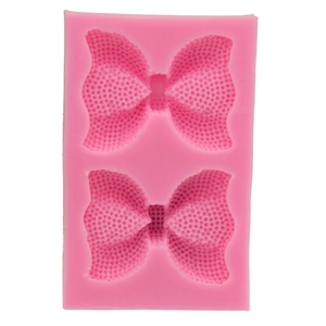 Moule en silicone rose pour fondant en forme de nœud avec texture nid d'abeille détaillée
