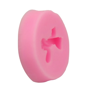 Close-up of pink 3D bow silicone mold for DIY cake fondant and baking crafts