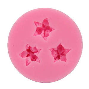 Pink silicone cake mold featuring three star flower shapes for DIY baking and fondant