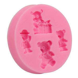 Detail of pink silicone mold featuring four distinct bear shapes for fondant and baking