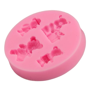 Detailed close-up of pink silicone mold with four cute teddy bear shapes for DIY baking