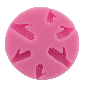 Pink circular silicone mold featuring six palm hand shaped cavities for soap and DIY baking