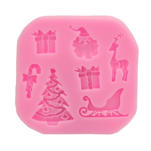 Pink silicone Christmas cake mold with 6 cavities featuring Santa, tree, and reindeer designs